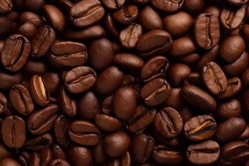 Fototapeta premium Close close-up of roasted coffee beans with copy space.