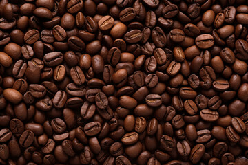 Close close-up of roasted coffee beans with copy space.