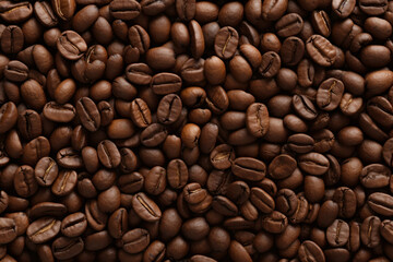 Close close-up of roasted coffee beans with copy space.