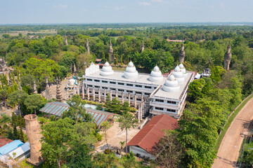 Obraz premium Aerial top view of Sala Keoku Sculptures Park, Isan pagoda is a buddhist temple, Nong Khai, an urban city town, Thailand. Thai architecture landscape background. Tourist attraction landmark.