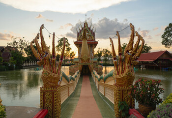 Aerial top view of Wat Phra That Suphannahong, The Isan pagoda is a buddhist temple in Sisaket, an urban city town, Thailand. Thai architecture landscape background. Tourist attraction landmark.