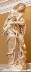 NAPLES, ITALY - APRIL 21, 2023: The baroque marble statue of Madonna with St. John the Baptist...