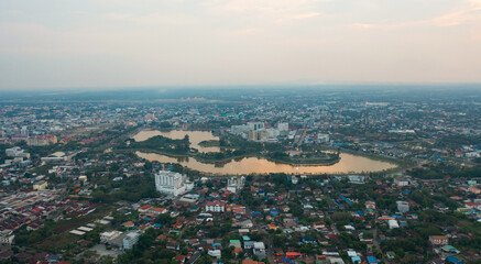 Aerial view of Udon Thani, residential neighborhood roofs. Urban housing development from above. Top view. Real estate in Kalasin, Isan province city, Thailand. Property real estate.