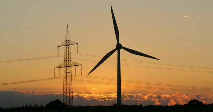 Clouds, high-voltage pylon, wind power station, sunset, Melbeck, Ilmenau municipality, Lower Saxony, Germany, Europe