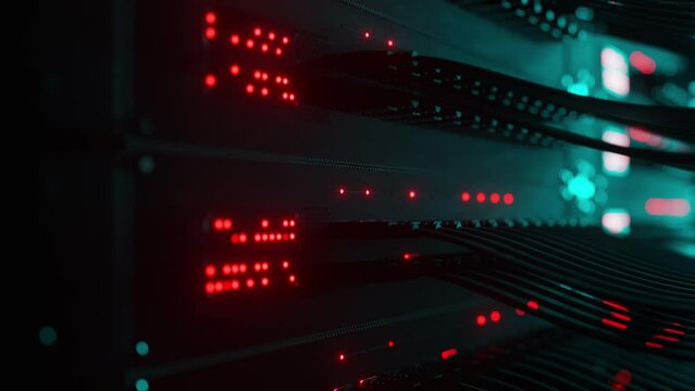 Super computer server racks in datacenter. Concept of big data storage and mining cryptocurrency. Network routers of ISP. Many wires connect to the network interfaces of powerful internet servers