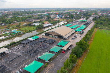 Aerial top view of tent of cars auction center.