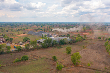 Fototapeta premium Aerial top view of concrete industry factory in urban city town. Business distribution logistic transport in Thailand.