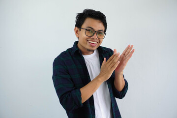 young asian man showing happy expression clapping with to give appreciation isolated on white background