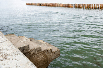 Abstract view of pier with staircase.