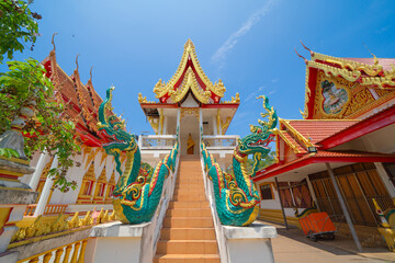 Fototapeta premium The Isan pagoda is a buddhist temple near Bangkok, an urban city town, Thailand. Thai architecture landscape background. Tourist attraction landmark.