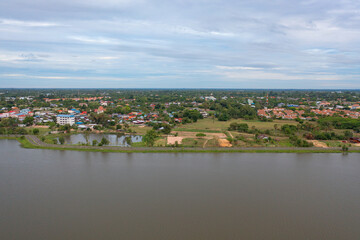 Aerial top view of a garden park with green forest trees, river, pond or lake. Nature landscape background, Thailand.