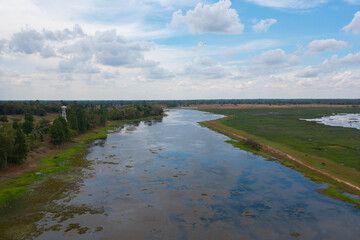 Aerial top view of a garden park with green forest trees, river, pond or lake. Nature landscape background, Thailand.