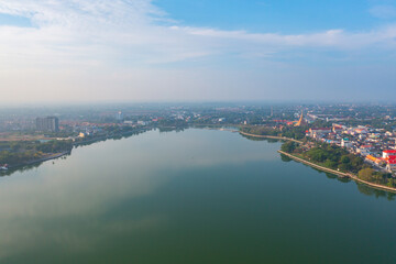 Naklejka premium Aerial view of local residential neighborhood roofs. Urban housing development from above. Top view. Real estate in Isan, Khon Kaen urban city town, Thailand. Property real estate.