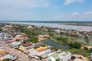 Aerial view of local residential neighborhood roofs. Urban housing development from above. Top view. Real estate in Isan urban city town, Thailand. Property real estate.