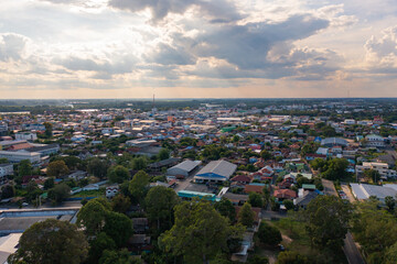 Aerial view of local residential neighborhood roofs. Urban housing development from above. Top view. Real estate in Isan urban city town, Thailand. Property real estate.