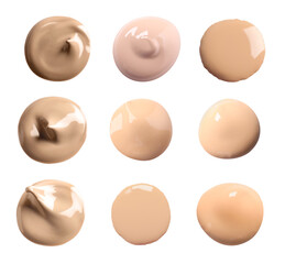 Set of liquid foundation samples in different tones on white background
