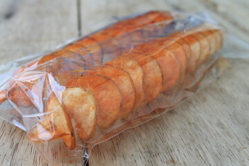 Spiral fries in plastic on table