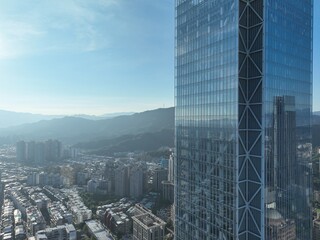 A curtain wall is an outer covering of a building in which the outer walls are non-structural, designed only to keep the weather out and the people in.