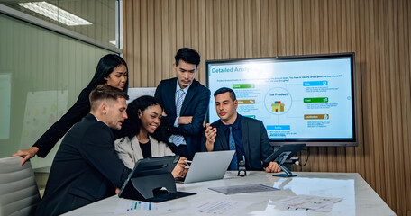 Diverse team innovates for sales KPIs via collaborative brainstorming to develop business models.