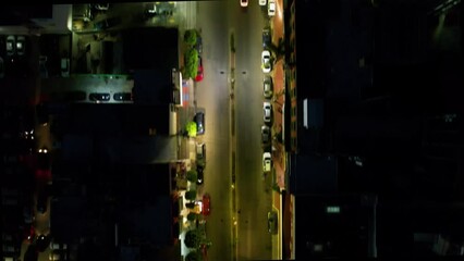 Downtown Tijuana at night flying near Hong Kong top view.