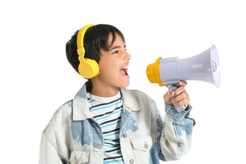 Little boy with headphones shouting into megaphone on white background