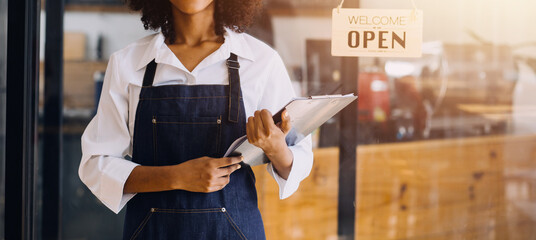 Startup successful small business owner sme beauty girl stand with tablet smartphone in coffee shop...