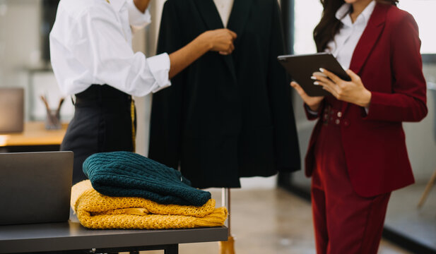 Fashion designer working in studio. Close up design.