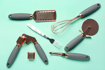 Set of kitchen utensils on turquoise background