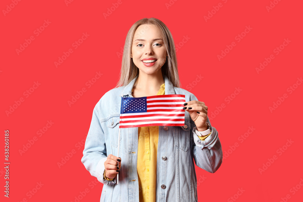 Canvas Prints Young woman with USA flag on red background