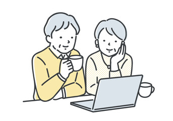 パソコンを見ているシニア夫婦