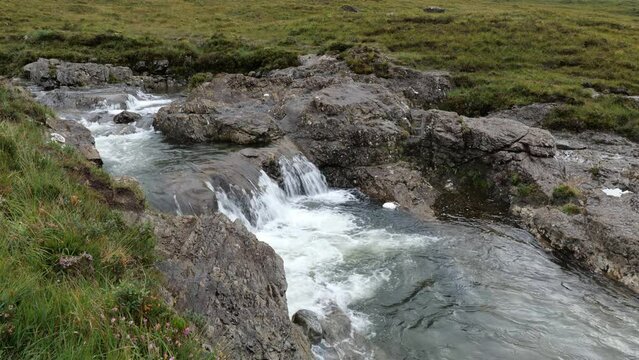 Small waterfall near Fairy Pools waterfall in Glen Brittle, Isle of Skye, Scotland, UK with highland midges insects