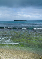 Dark grey and blue View of Ile Bayonnaise from the shore