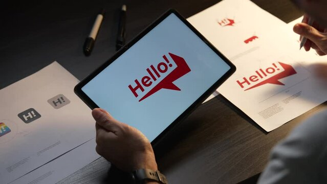 Asian man graphic designer working on computer drawing sketches logo design. The concept of a new brand. Professional creative occupation with idea.