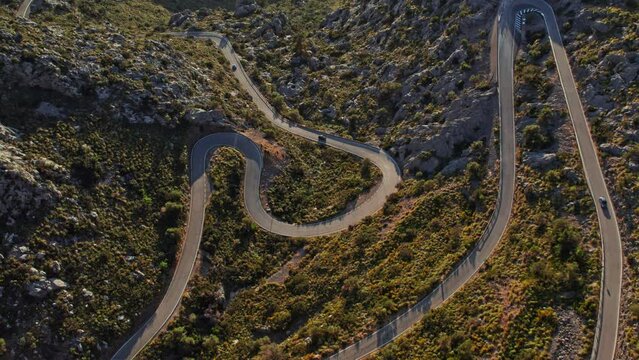 Aerial Drone View Of The Winding Road Of Nus de sa Corbata At Coll dels Reis Mountain Pass In Mallorca, Spain.