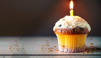 muffin or a small cake with a burning candle. concept of congratulation, holiday.