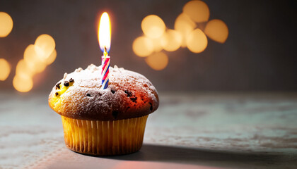 muffin or a small cake with a burning candle. concept of congratulation, holiday.