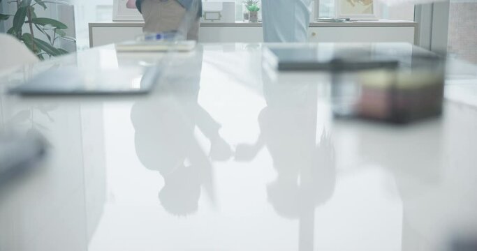 Table reflection, together and talking business people with coffee, conversation and on a break. Working, job and corporate employees with shadow in a desk while speaking with a tea drink at work