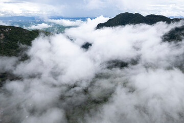 Top view Landscape of Morning Mist with Mountain Layer at north of Thailand. mountain ridge and clouds in rural jungle bush forest