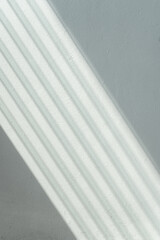 Light Shining Through Glass Louvers Window On The Blue Pastel Color Wall Pattern Background, Soft Light Pattern On The Blue Pastel Color Wall, Sun Shining Through Window Blinds