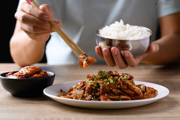 Korean stir fried kimchi cabbage with pork eating with kimchi and cooked rice