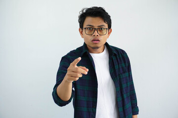young asian man showing confused face expression with pointing forward isolated on white background