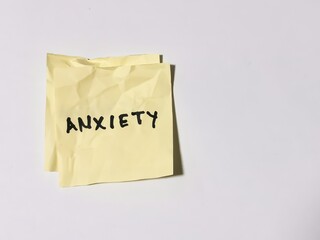 Word anxiety written on wrinkled paper note.