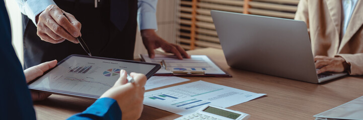 Group of business colleague read finance data to discuss and coworking about marketing of business