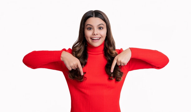 teen girl point finger here. teen girl show advertisement here. here is your advertising. teen girl directing to advertisement. pointing finger down here. Creative advertisement