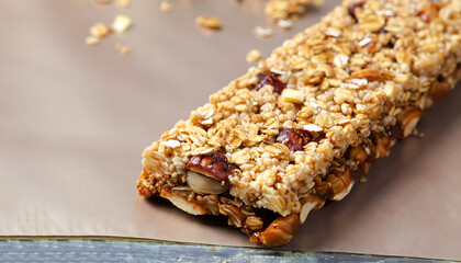 Granola bar with hazelnut cream, sweet sugary snack, sweetness and aromas of Apple Pie, selective focus of delicious candy of mixed granola and hazelnut