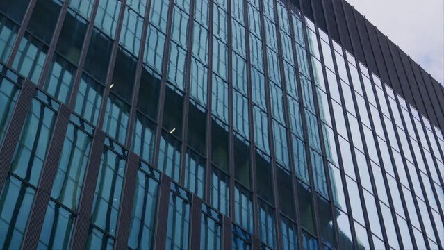 Windows reflects building exterior in central business district, abstract slider