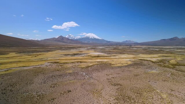 Aerial view over of the scenic Lauca National Park, Chile - dolly forward, drone shot