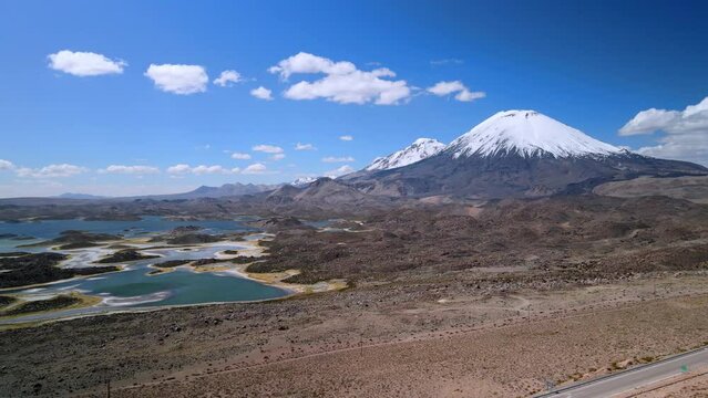 Aerial view of Parinacota Volcano, Lauca National Park in Chile - dolly, drone shot