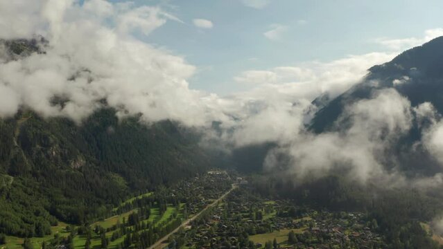 Aerial slider shot of mountain valley town