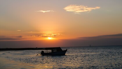 boat at sunset with background blurred